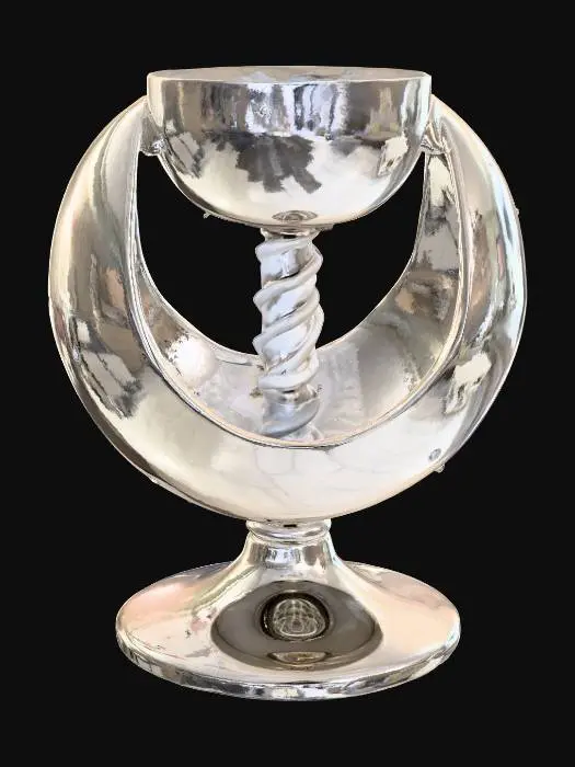 3D model for A futuristic chalice where the cup is a perfectly smooth polished silver sphere split open at the top, and the stem is shaped like a twisting helix with a mirrored chrome finish. The base is a flat disc with a beveled edge, reflecting light like liquid metal. The spherical cup contrasts the spiral stem, giving it a blend of organic and engineered design while keeping the whole object glossy and reflective.

