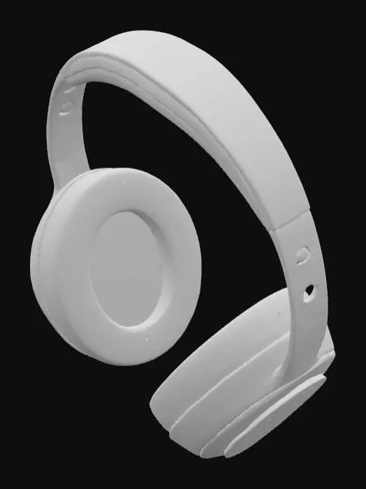 3D model for Create a hyper-realistic 3D model of a futuristic over-ear headphone. Use smooth titanium and matte carbon fiber materials with soft LED rings on the earcups. Include touch controls with a subtle holographic glow. Cushions should be memory foam wrapped in breathable vegan leather. The headband must be flexible, self-adjusting alloy. No branding or logos. Style: sleek, high-tech, next-gen product. Include detailed PBR textures and HDRI lighting. Suitable for product renders and animations.
