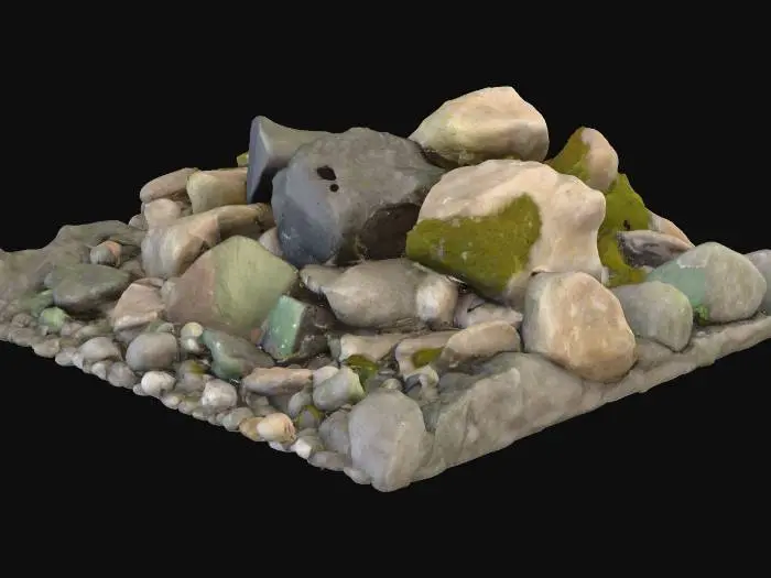 3D model for A collection of various game-ready rock models, featuring irregular, angular shapes ranging from small pebbles to medium-sized boulders. Their material is a rough, unpolished stone, displaying a granular texture with visible erosion, cracks, and mossy patches in crevices. Colors vary from earthy greys and browns to subtle hints of dark green. Each rock feels solid and weighty, designed to blend naturally into a game environment, appearing robust and naturally occurring.