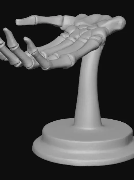 3D model for A meticulously articulated human skeleton hand, posed palm upward as if cradling something. It features an aged, ivory-white bone appearance with subtle porous textures and fine hairline cracks. The hand rests on a sleek, dark polished obsidian stand, providing a stark, elegant contrast. The delicate phalanges and metacarpals reveal precise anatomical structure and a hard, dry tactile quality.