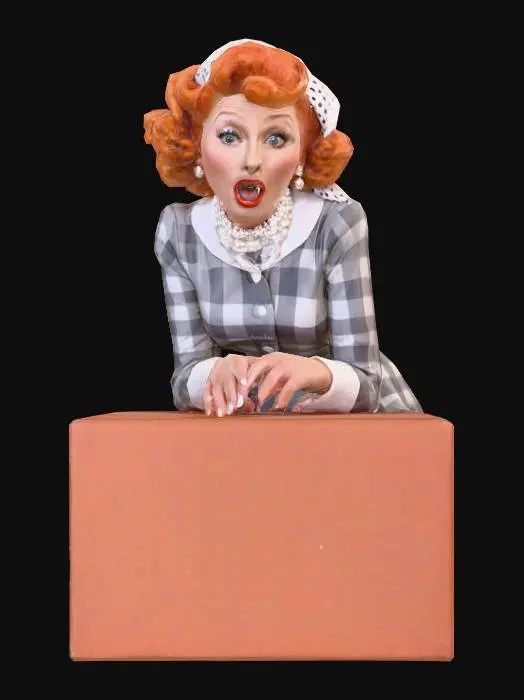 3D model for A human female character of lucille ball with bright reddish-orange hair styled in voluminous curls, wearing a checkered grey and white button-up dress with a white collar and cuffs, and a white polka-dot headscarf. Her skin has a smooth, matte finish, and she wears a white pearl choker. She stands with a wide-open mouth expressing surprise or excitement, leaning slightly forward with hands placed on a dark wooden counter.