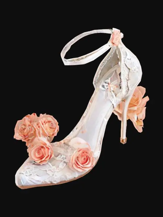 3D model for {
"Object": "White high heel shoes with rose flower decorations and lace details",
"Material": "Satin base, sheer lace fabric, and soft faux florals",
"Shape/Form": "Elegant stiletto design with ankle strap and layered floral heel",
"Color Scheme": "White and cream base with peach and blush pink roses",
"Texture Details": "Delicate lace, velvet flower petals, glossy heel",
"Style": "Stylized",
"Environment/Use Context": "Bridal display, luxury boutique setting",
"Reference Models": "Inspired by vintage-inspired bridal footwear"
}