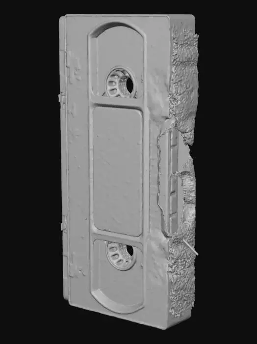 3D model for A grimy, forgotten VHS tape, its black plastic shell scratched and peeling, with a faded, handwritten label scrawled with ominous, smudged red ink reading "DO NOT PLAY." The tape's structure is standard, but a corner is conspicuously snapped off, and a few strands of dark magnetic tape are visibly unraveling from the bottom, possessing a stiff, yet fragile texture. #Halloween2025#