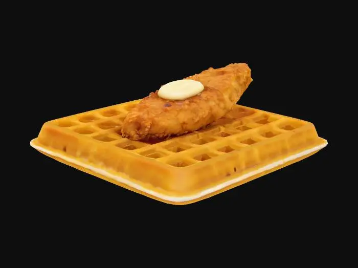 3D model for A tiny, fluffy square of golden waffle with a crispy edge, topped with a bite-sized piece of fried chicken. The chicken has a crunchy, textured coating with flecks of seasoning and a warm golden hue. A small pat of melted butter glistens on top, with a drizzle of amber maple syrup pooling around the base.