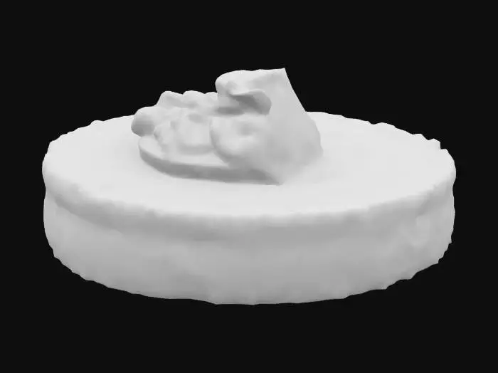 3D model for A small polenta round, pan-fried to a crisp edge with a golden, grainy surface, holds a dab of creamy blue cheese (pale with light blue veining). Topped with a toasted walnut half—wrinkled, matte tan—and a drizzle of thick balsamic glaze, almost black and glossy.

