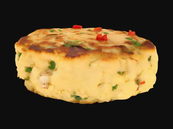 3D model for A compact, pan-seared crab cake—golden-brown crust with a slightly uneven surface texture from crab flakes. The interior is moist and pale with visible chunks of crab meat, herbs, and a hint of diced red pepper.