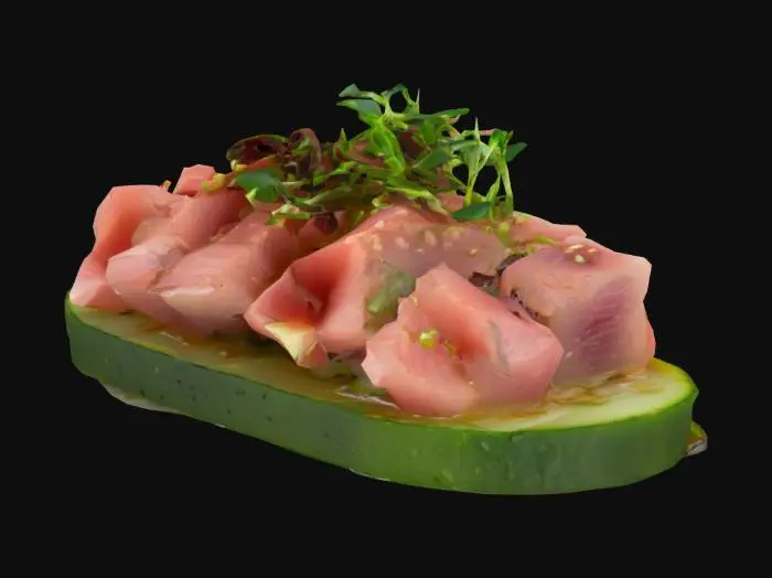 3D model for A thin, crisp cucumber slice topped with a small mound of finely diced tuna tartare, glossy with sesame oil and soy sauce. Garnished with a sprinkle of sesame seeds and microgreens.