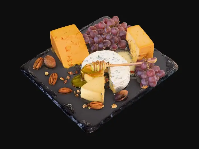 3D model for Un tagliere gourmet con varie specie di formaggi stagionati, uva rossa, miele colato, noci pecan, su pietra scura, texture contrastata, luce soft backlight.