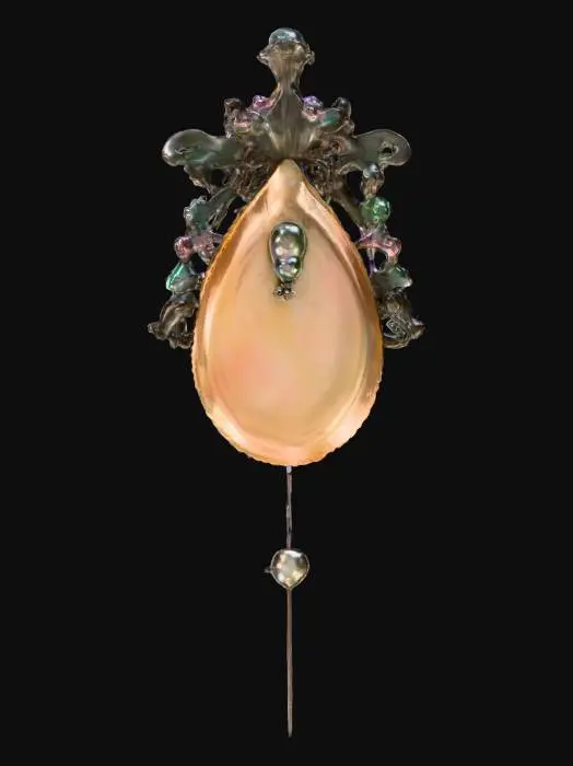 3D model for A long, slender hair pin, characteristic of Victorian elegance, features a silver body intricately embossed with floral motifs. The head of the pin is adorned with a large, teardrop-shaped mother of pearl piece, exhibiting a creamy white color with faint pink and green overtones. It is framed by a delicate border of minute, square-cut emeralds and tiny, round sapphires, creating a captivating sparkle.