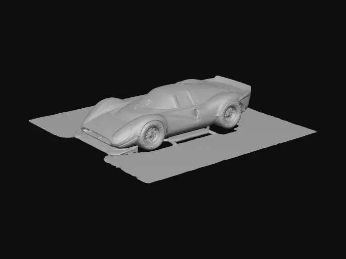 3D model for An ultra-realistic, highly detailed image of an extreme widebody 1967 Ferrari 330 P4 prototype racing car, with oversized rear tires, and an aggressive stance, parked on a beachside board racetrack. It has a custom Chip Foose body kit with deep side skirts, side pipes, extended wheel arches with heat extractor cutouts, a lowered and stretched frame, Liberty Walk Mitsuoka Orochi racing modifications, blended with vintage racing flair and livery. Pearlescent extreme metalflake yellow paint contrasts with flat black accents, showing wear textures. Retro turbine-style wheels are wrapped in cheater slicks with small white lettering. Ultrarealistic render with 35mm lens depth and cinematic lighting. High fidelity texture on carbon fiber panels, realistic lighting gradients.