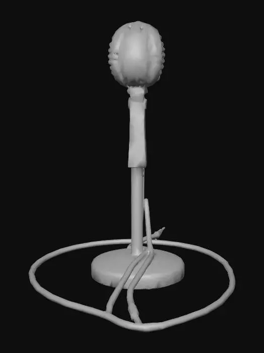 3D model for A low-poly vintage microphone stand, lying horizontally, exhibits a worn metal texture with subtle scratches and dull reflections. Its skeletal structure, simplified into distinct polygons, suggests a lightweight yet sturdy construction. A dark, flexible cable extends from the stand, coiling naturally onto the surface, hinting at a smooth rubberized feel. The metallic elements are a muted, slightly tarnished silver-grey, contrasting with the uniform dark tone of the trailing cable.