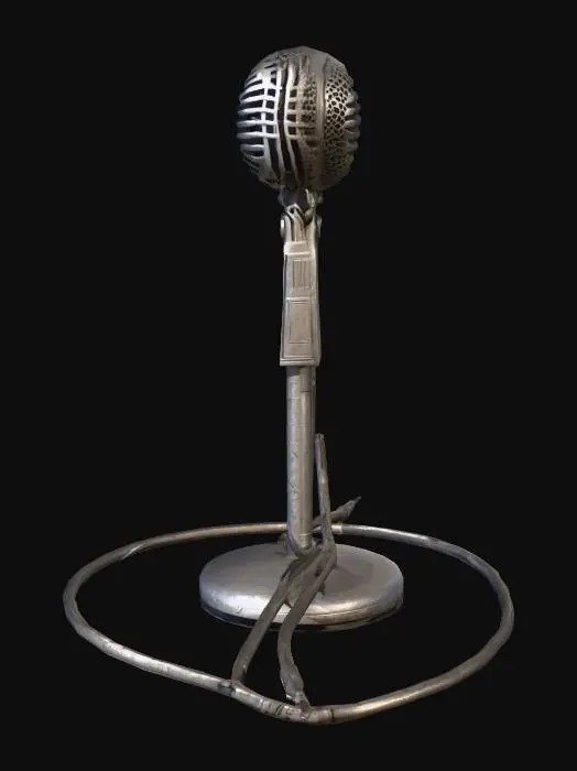 3D model for A low-poly vintage microphone stand, lying horizontally, exhibits a worn metal texture with subtle scratches and dull reflections. Its skeletal structure, simplified into distinct polygons, suggests a lightweight yet sturdy construction. A dark, flexible cable extends from the stand, coiling naturally onto the surface, hinting at a smooth rubberized feel. The metallic elements are a muted, slightly tarnished silver-grey, contrasting with the uniform dark tone of the trailing cable.