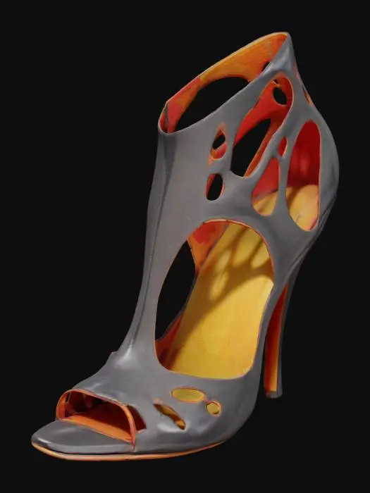 3D model for The object is a high-heeled shoe with an intricate, sculptural design featuring open cutouts and a combination of glossy black and orange leather texture.,