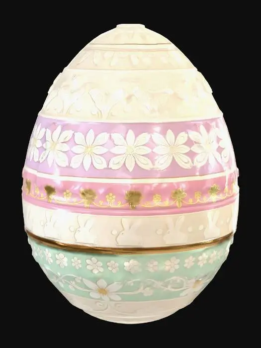 3D model for A detailed 3D Easter egg with repeating horizontal bands.

The egg has layered decorations:
- a row of small cute rabbits
- a row of spring flowers (tulips, daisies, soft petals)
- repeating pattern: rabbits, flowers, rabbits, flowers

A decorative 3D Easter egg inspired by hand-drawn botanical line ar

Pastel colored Easter egg with soft pink, lavender, light yellow and mint green bands. 
Golden metallic details on the embossed patterns (rabbits and flowers), shiny reflective gold accents, elegant and soft lighting.

Style: slightly stylized but semi-realistic
Surface: smooth, clean geometry, not too dense
Details: embossed or slightly raised patterns (not too deep)
Colors: soft pastel tones (pink, yellow, light green, lavender)

Centered object, clean topology, game-ready, optimized mesh