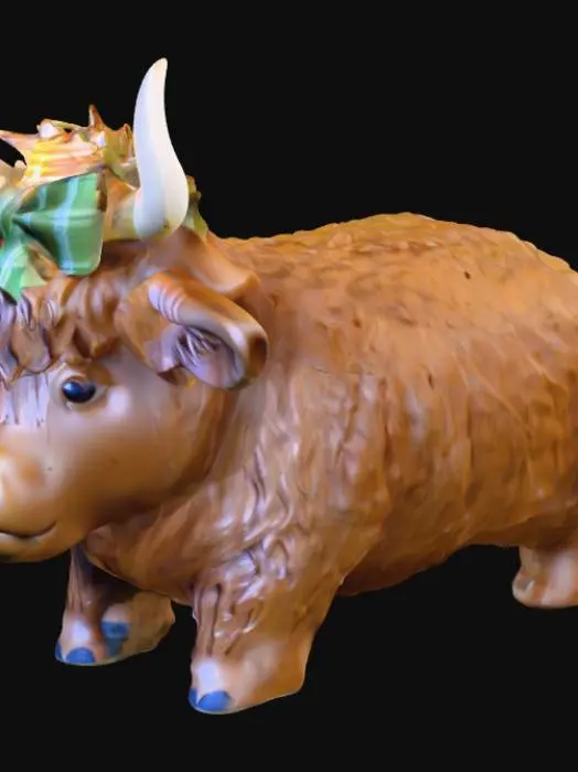 3D model for Create me a cute highland cow model with a bow in its hair. Must be hollow and have a 3.8cm hole in the bottom to hold a tea light.