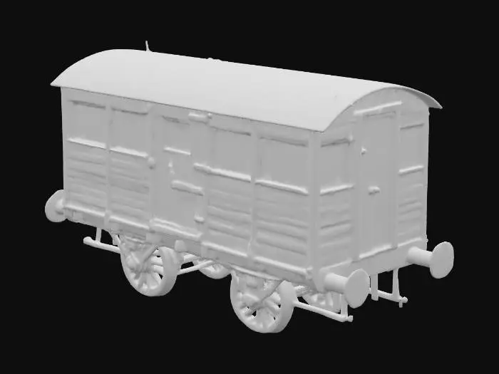 3D model for Ein kompakter Wohnwagen, der an einen historischen Eisenbahnwaggon erinnert, mit einer Außenhaut aus dunklem, geöltem Holz, das eine warme, raue Maserung zeigt. Schwarze Schmiedeeisenbeschläge und robuste Scharniere zieren die kleine Eingangstür. Die kleinen, quadratischen Fenster sind mit dicken Holzrahmen versehen. Unter dem Wagen befinden sich massiv wirkende Achsen mit kleinen, widerstandsfähigen Rädern, die seine stabile, fast schienenfahrzeugartige Präsenz unterstreichen.