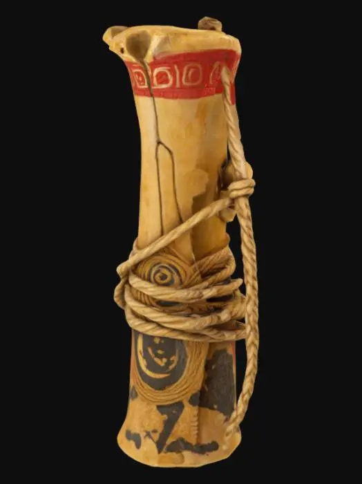 3D model for a large aged animal bone wrapped in ancient rope. Standing tall and carved with red and gold markings. Ultra high resolution. 