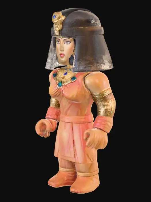 3D model for A Roblox game character depicting Cleopatra, highly detailed and ancient Egyptian in style, stands symmetrically. Her blocky yet elegant form is adorned with a polished golden headdress featuring a cobra emblem, and a smooth, vibrant blue and white nemes. The character's attire consists of a crisp, white linen-like tunic with geometrically patterned golden armbands and collar, suggesting a sleek, hard plastic texture. Her features are subtly stylized, maintaining a regal and stoic expression, while small, intricate hieroglyphic details are etched onto her accessories.