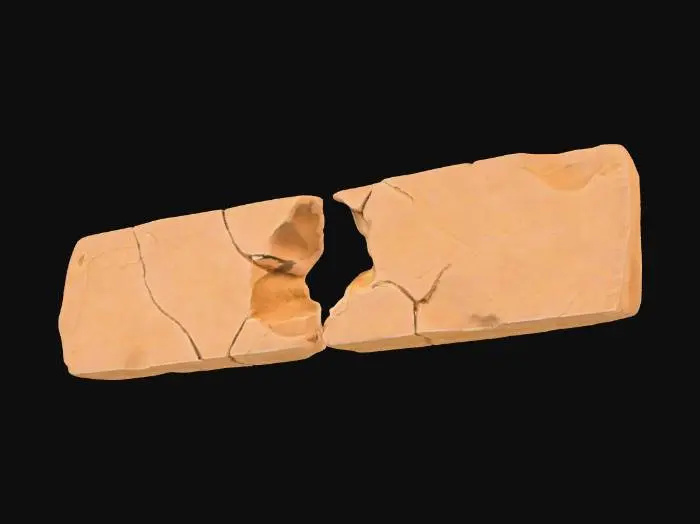 3D model for A second broken sandstone rib segment, this one featuring a prominent midspan hole that pierces through its robust form, creating a weathered aperture. The inner edges of this hole are jagged and irregular, suggesting natural erosion or forceful impact. Despite the central void, it retains its flat end caps, making it suitable for modular tiling. Composed of granular sandstone, it exhibits warm ochre and reddish-brown hues, with a rough, weathered texture across both its exterior and the exposed interior of the hole.