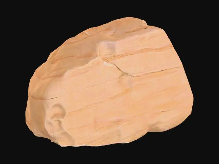 3D model for An oblong sandstone boulder, measuring approximately 2.0 x 1.6 x 1.3 meters, possesses a rugged, elongated form. One prominent corner is sharply broken, revealing a freshly fractured surface that contrasts with the generally weathered exterior. This break clearly exposes distinct, variegated sediment layers within the stone, showing bands of light ochre, sandy brown, and muted reddish-brown. The intact surfaces have a coarse, gritty texture, typical of natural sandstone, feeling solid and rough to the touch.