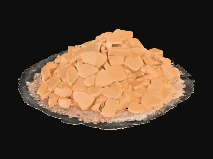 3D model for A small masonry debris pile, measuring 1x1x0.5 meters, forms a low, irregular mound. It consists of numerous scattered, angular small blocks of various sizes, primarily composed of a light, sandy-colored masonry material, possibly sandstone, with some darker fragments. The blocks have rough, broken surfaces and sharp edges. Fine, pale dust heavily coats and settles between the blocks, creating a soft, powdery texture. The pile feels fragmented and gritty to the touch, with individual pieces feeling solid and abrasive.