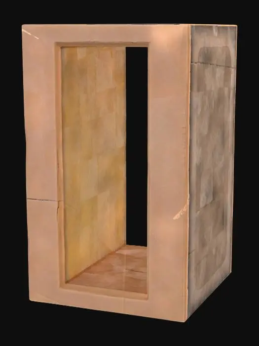 3D model for A vertical window slit, measuring 0.3x0.9x0.3 meters, forms a narrow, deep opening within a robust wall structure. The stone, likely a type of sandstone, is a muted, sandy brown, exhibiting a fine, gritty texture across its main surfaces. A distinctive chamfered reveal angles smoothly outwards from the inner edge of the slit, creating a finished, widened opening on one side. This chamfered surface feels cool and subtly polished, contrasting with the rougher, exposed facets of the surrounding stone.