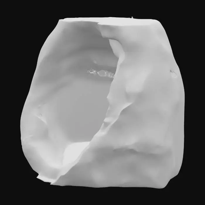 3D model for A compact sandstone alcove bowl featuring a noticeably tighter, deeper cavity. Its surface is detailed with numerous exfoliation chips, revealing fresh layers of rock and contributing to a rough, fractured texture. The underhang of the alcove is distinctively darkened with a natural desert varnish, providing a striking contrast to the lighter ochre and russet tones of the sandstone. The robust material is granular, with a weathered yet solid appearance, perfect for a natural rock formation.