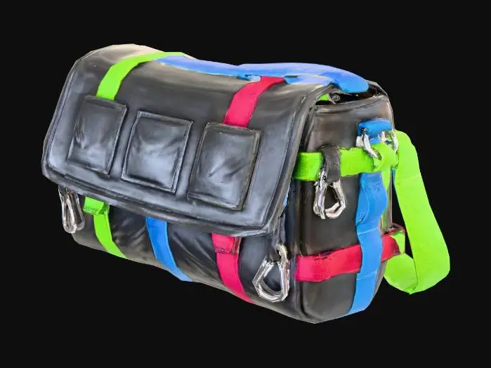 3D model for Stylized 3D game prop. A larger side “mule” bag worn cross-body: a messenger-style bag with a big front flap covering the main compartment and two or three flat pockets sewn onto the flap. Straps, loops and a couple of small metal carabiners run along the sides, suggesting extra attachment points. The base fabric is dark gray or charcoal, with bright colored straps (lime, red or blue) for a striking contrast. The bag shape is long and wide, clearly indicating more capacity than a simple waist bag. Saturated colors, bright metallic and fabric highlights, isolated on pure white background, soft studio lighting, clean readable silhouette.