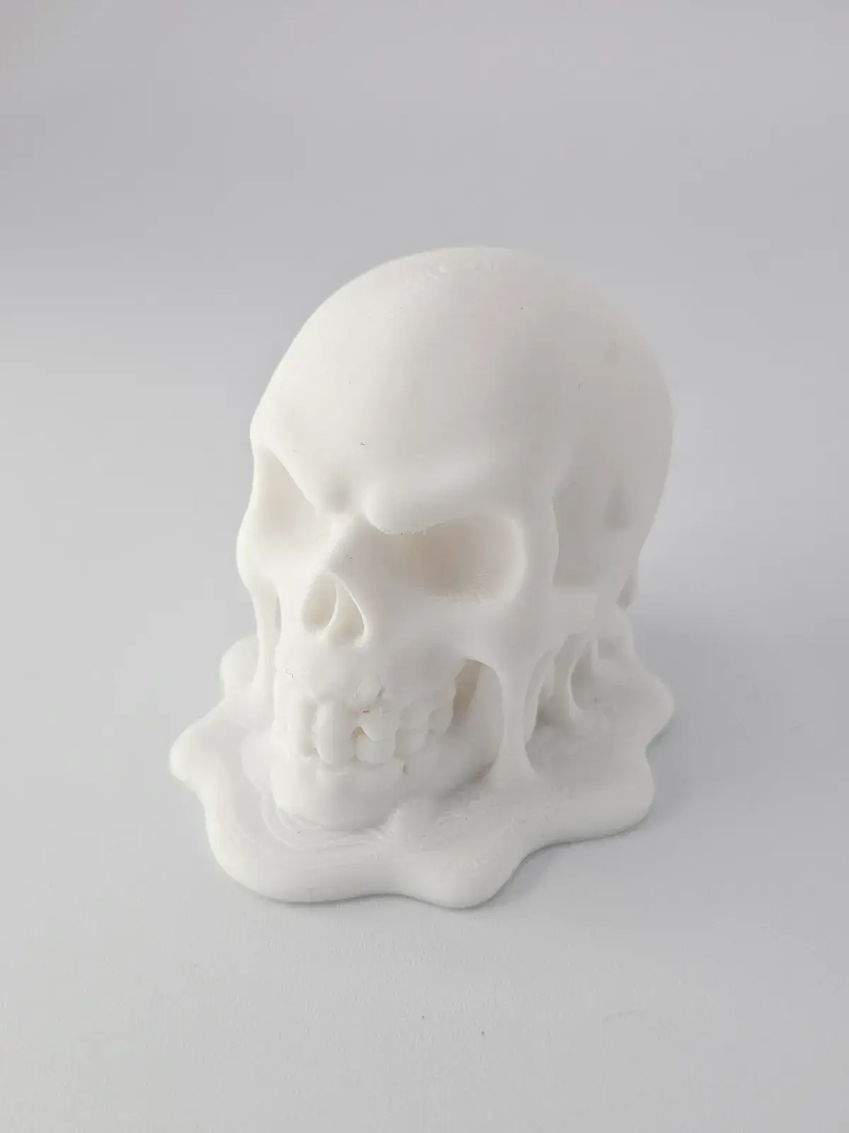 Melting Skull Display Sculpture 3D print file — real print photo by John Sirard