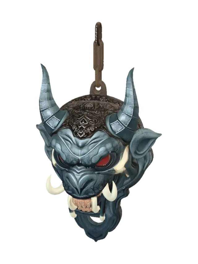 3D model for {
  "prompt": "Create a highly detailed 3D model of a decorative oni demon head. The head should feature exaggerated facial features: sharp teeth, red eyes, two ivory-colored horns and tusks, with a sculptural style in shades of blue and gray. The model must be a standalone head (without the bottle), designed as a decorative element. Include a through-hole at the top of the head to allow a rope to pass through for hanging. Target size: approximately 4–6 cm in height, proportioned to sit on top of an air freshener bottle cap. Output format: STL or OBJ suitable for 3D printing. Style: realistic sculptural texture resembling stone or ceramic.",
  "options": {
    "size": "4-6 cm height",
    "output_format": ["STL", "OBJ"],
    "style": "realistic sculptural, stone/ceramic texture",
    "colo