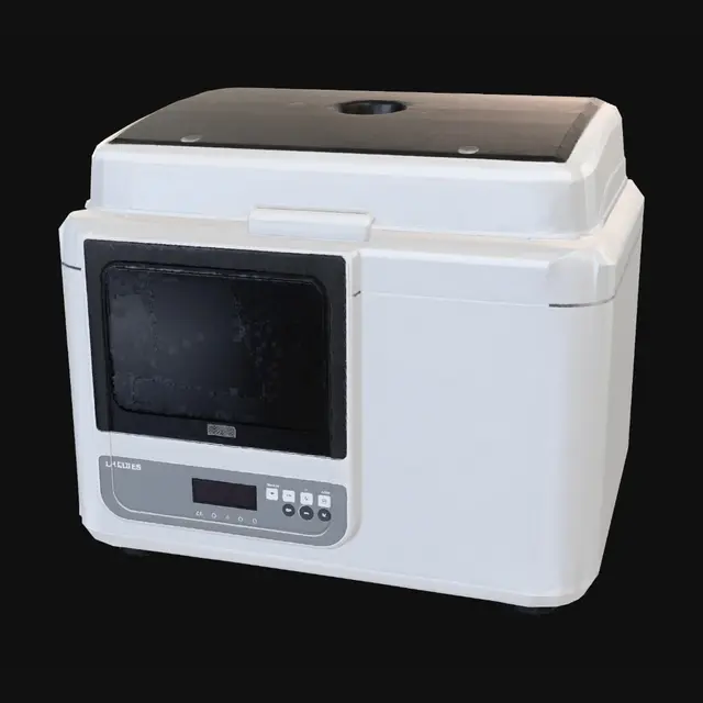 3D model for PCR thermal cycler for DNA amplification. Compact rectangular box, 40x40x25cm. Light gray matte plastic housing with rounded edges. Hinged top lid opens to show 96-well heating block inside. Front panel has small LCD screen, membrane buttons, LED indicators. Sleek modern medical device look like Bio-Rad T100. Dark tinted lid window. Black rubber feet. No cables or tubes.