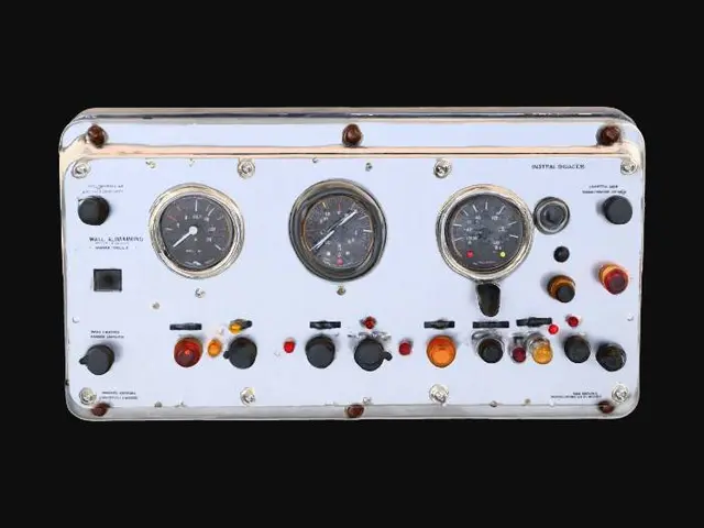 3D model for object: Industrial Wall-Mounted Control Panel
material: Brushed aluminum housing with rubberized knobs and glass-covered gauges
shape_form: Rectangular box with extruded control dials, toggle switches, and warning lights
color_scheme: Steel gray base, black knobs, red and amber indicator lights, light rust around panel edges
texture_details: Subtle brushed metal texture, smudged glass surfaces, grime buildup in crevices, rubber grip ridges on knobs
style: PBR
environment_use_context: Sci-fi spaceship engine room or factory control bay
reference_models:
  - "Alien: Isolation control units"
  - "Half-Life 2 industrial panel"
, #PBR#