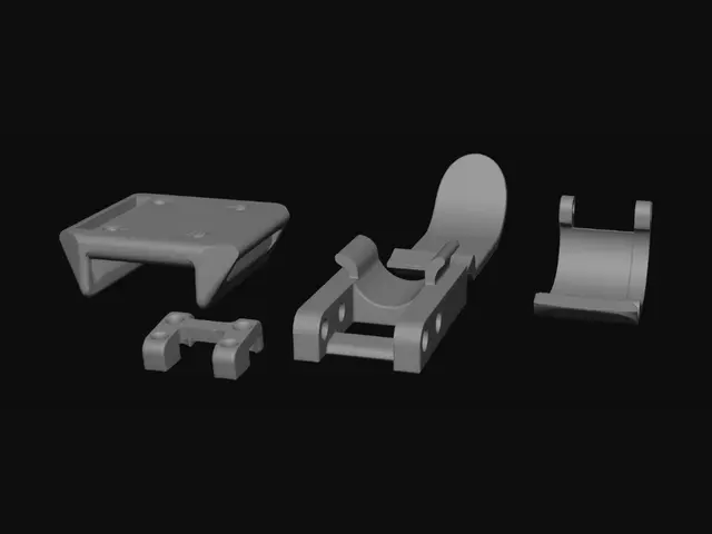 3D model for Orange 3D-Printed Parts on a Gray Surface