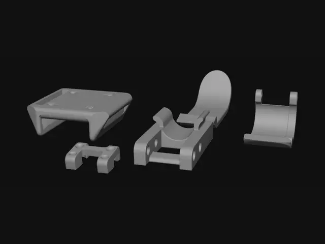3D model for Orange 3D-Printed Parts on a Gray Surface