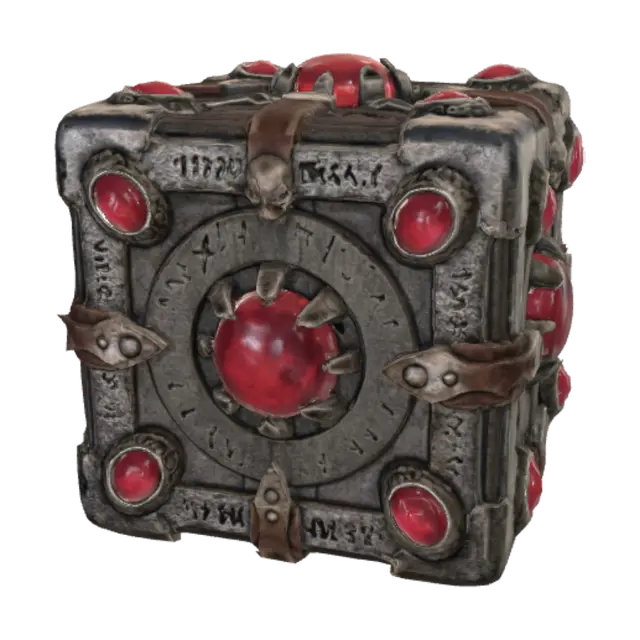 3D model for It is a small, symmetrical black metal cube with golden trimm that has massive red gems which occupy the majority of each of its faces (there is one gem on each face that is big enough to take up most of the space). on each of the gems is a different shape carved out of it: there is a simple mountain shape, a simple hourglas shape, a simple upside down crown shape, a simple simbol of a triangle with a line through it, and a simple hollow skull symbol. the sixth side looks like it might have had a circle etched into it, but the gem on that side is fractured so much that it is hard to tell
