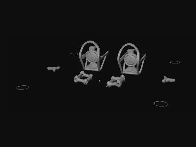 3D model for Miniature brass cages on a metal workbench