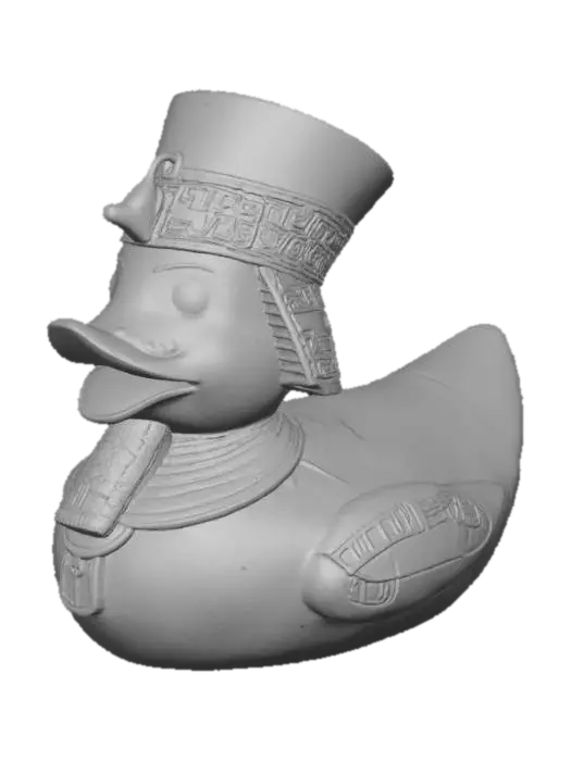 3D model for A Pharaoh rubber duck, solid 3D model. Classic rounded duck body adorned with an ancient Egyptian Nemes headdress, bold and stylized for printing. A sculpted ceremonial beard extends from the beak. Wings decorated with carved hieroglyphic patterns and ankhs in embossed relief. A staff and crook crossed across the chest, chunky and durable. Surface detailed with simple geometric engraving for texture. Watertight geometry, bold forms, and no fragile thin parts