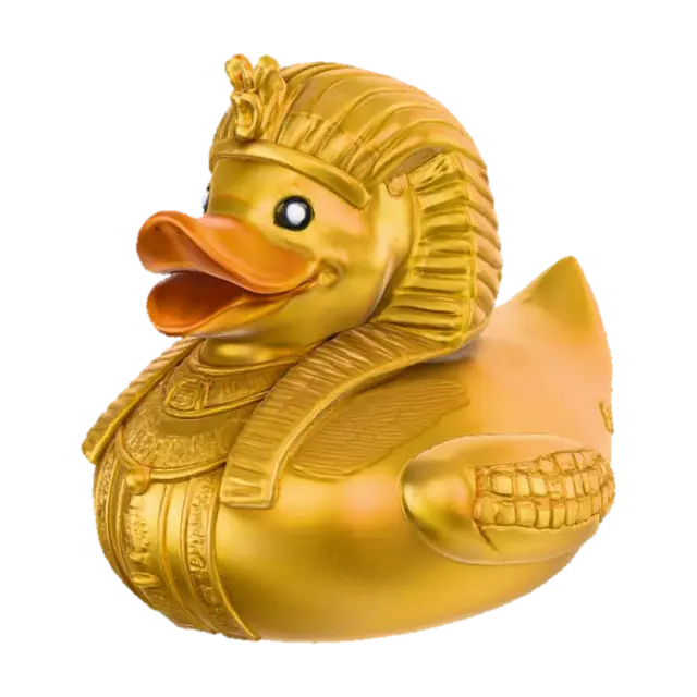3D model for A Pharaoh rubber duck, solid 3D model. Classic rounded duck body adorned with an ancient Egyptian Nemes headdress, bold and stylized for printing. A sculpted ceremonial beard extends from the beak. Wings decorated with carved hieroglyphic patterns and ankhs in embossed relief. A staff and crook crossed across the chest, chunky and durable. Surface detailed with simple geometric engraving for texture. Watertight geometry, bold forms, and no fragile thin parts