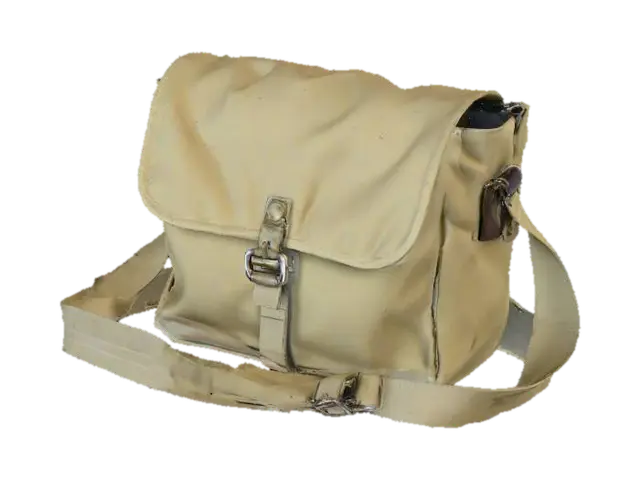 3D model for A vintage army messenger bag, compact and rectangular, in a muted, desaturated olive green canvas. The fabric is thick and slightly stiff, with faint, discolored streaks that hint at its age. It has a single main compartment with a buckle-down flap closure. A wide, adjustable canvas shoulder strap is attached, giving it a lightweight yet durable and authentic, worn tactile quality for carrying documents or small tools.