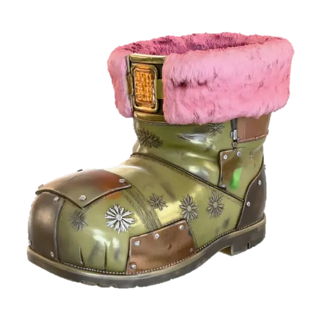 3D model for A **"Santa's Boot" storage unit**, an **asymmetric, worn khaki leather boot**, reinforced with **dark bronze plating** and **riveted, recycled plastic panels**. Its top opening is lined with **faded rose-pink synthetic fur**, concealing a **complex, glowing amber digital lock**. Etched **tribal glyphs of snowflakes** cover its surface, a cherished festive storage. #Christmas2025#