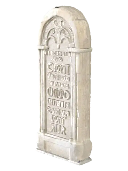 3D model for A substantial slab of stone, likely a muted grey or earthy hue, lies with a distinctly weathered appearance. Its surface feels rough and cool to the touch, bearing the marks of significant exposure to the elements. Intricate writing, rendered in a gothic font, is deeply chiseled into the stone. The lines of the inscription are softened and eroded by time, giving the text a faded yet distinct quality, emphasizing the ancient craftsmanship.