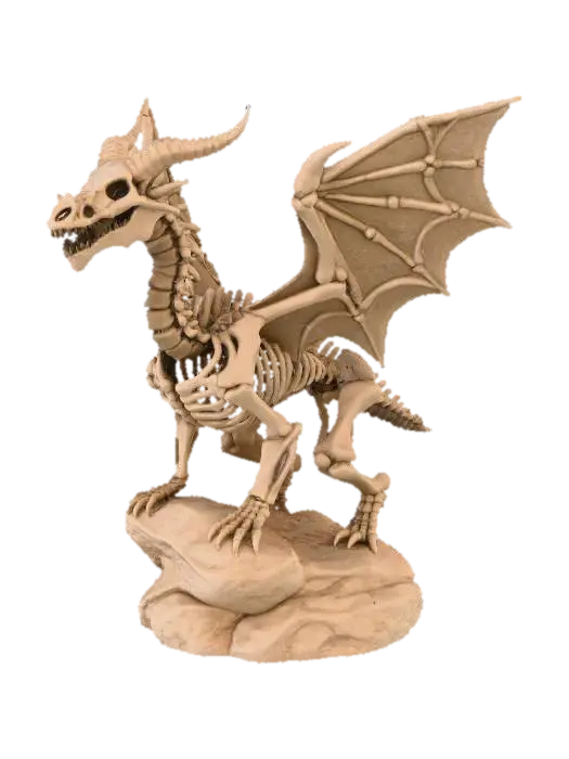 3D model for #Halloween2025#, A highly detailed 3D model of a dragon skeleton figurine, crafted from a coarse, granular sandy-brown material resembling aged sandstone or fossilized bone. The skeletal structure includes an articulated spine, rib cage, skull with prominent horns and hollow eye sockets, and large textured wings. The dragon is perched on an irregularly shaped, craggy rock base, all exhibiting a uniform earthy color and rough, tactile surface texture, with soft lighting defining its intricate forms.