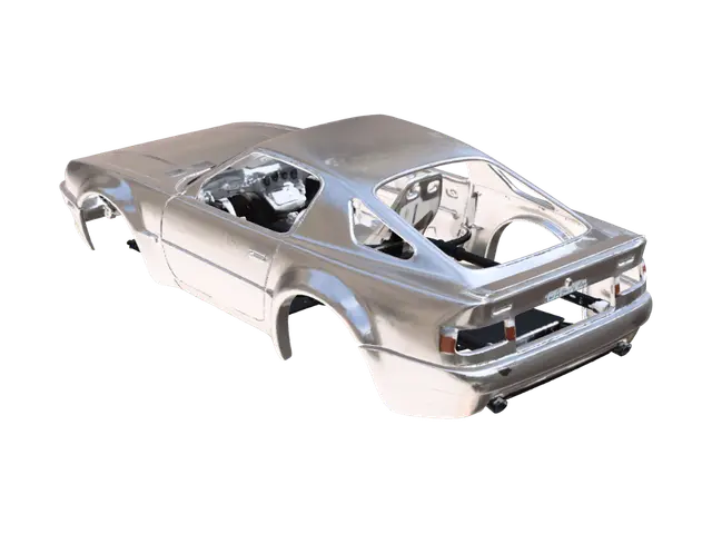 3D model for It needs to be the body shell of a 90s era British car. Perfectly symmetrical along it's length. Just the naked body shell. No windows. No wheels. No engine.