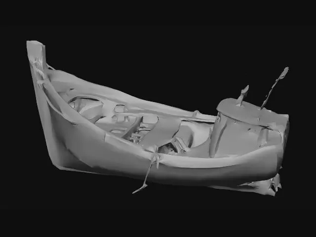 3D model for the rusted remains of a sunken metal fishing boat lying amongst rocks