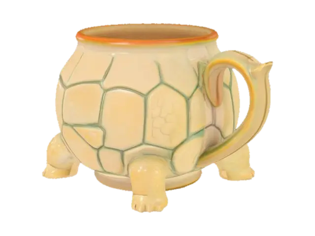 3D model for A ceramic turtle-shaped mug with a rounded, dome-like body forming the main cup, approximately 4 inches tall and 5 inches wide. The outer shell texture features raised, hexagonal segments across the surface, mimicking a real turtle’s carapace with slight indents between each plate. The mug's opening is circular, smooth-rimmed, and slightly wider than the shell's top, with a gentle lip for sipping. Four stubby turtle legs extend from the base, rounded and integrated into the mug's bottom for stability. A small sculpted turtle head protrudes from the front, with simple raised eyes and nostrils. The handle curves from the rear like a thick turtle tail, arched for a comfortable grip. The inside is smooth and fully hollow.