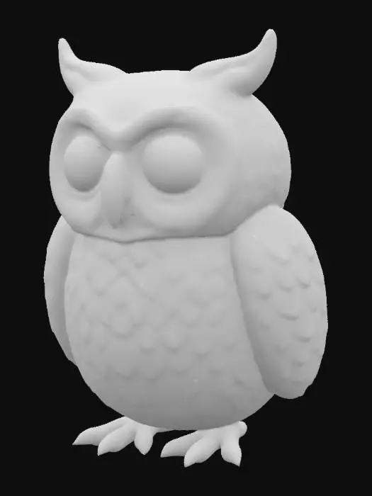 3D model for A quirky clay owl character. Its body is rounded and plump, with large, prominent eyes that are slightly recessed for a natural look. The clay has a shiny and smooth finish.