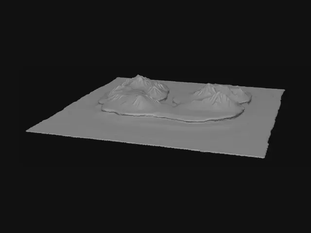3D model for Auf der linken Seite eine Küste mit Strand und leichten Wellen. in der Mitte eine hügelige Landschaft mit Gras bewachsen. Rechts schneebedeckte Berge. 
Aus den Bergen fließt ein Fluss zur Küste