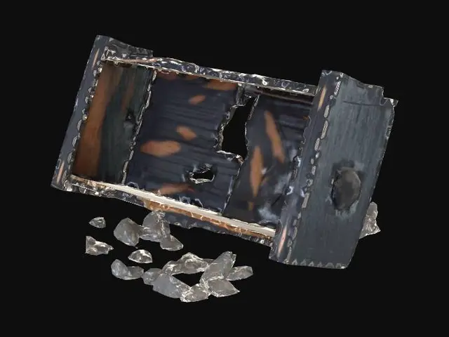 3D model for a Burned and broken wooden bookcase lies on its side, deeply charred and blackened from a fire. Very low res. It is rendered with clean, angular geometry.