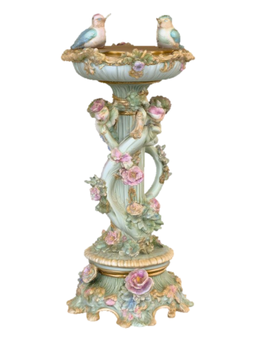 3D model for An elaborately designed pestal with a small bowl shapped base on top. The pedestal sits on a 3 inch base plate. The entire design is a masterpiece of art comprised of lush botanical, florals, cherubs and birds. Elements of Rocco, art nuevo era. Colors representing the victorian era.